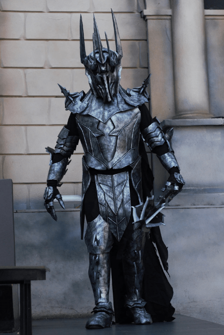 Front view of cosplayer wearing the Dark Realm Warlord Costume with full-body black EVA foam armor and spiked helmet.