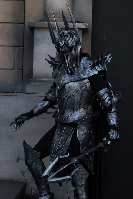 Side view of the Dark Realm Warlord costume showcasing intricate gauntlets, layered chest armor, and menacing silhouette.