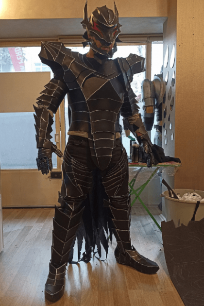 Right side view of barbarian cosplay armor showing hand-painted weathered finish and reinforced plating.