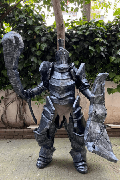 Cosplayer wearing a stone armor cosplay costume with realistic stone texture and detailed EVA foam plating.